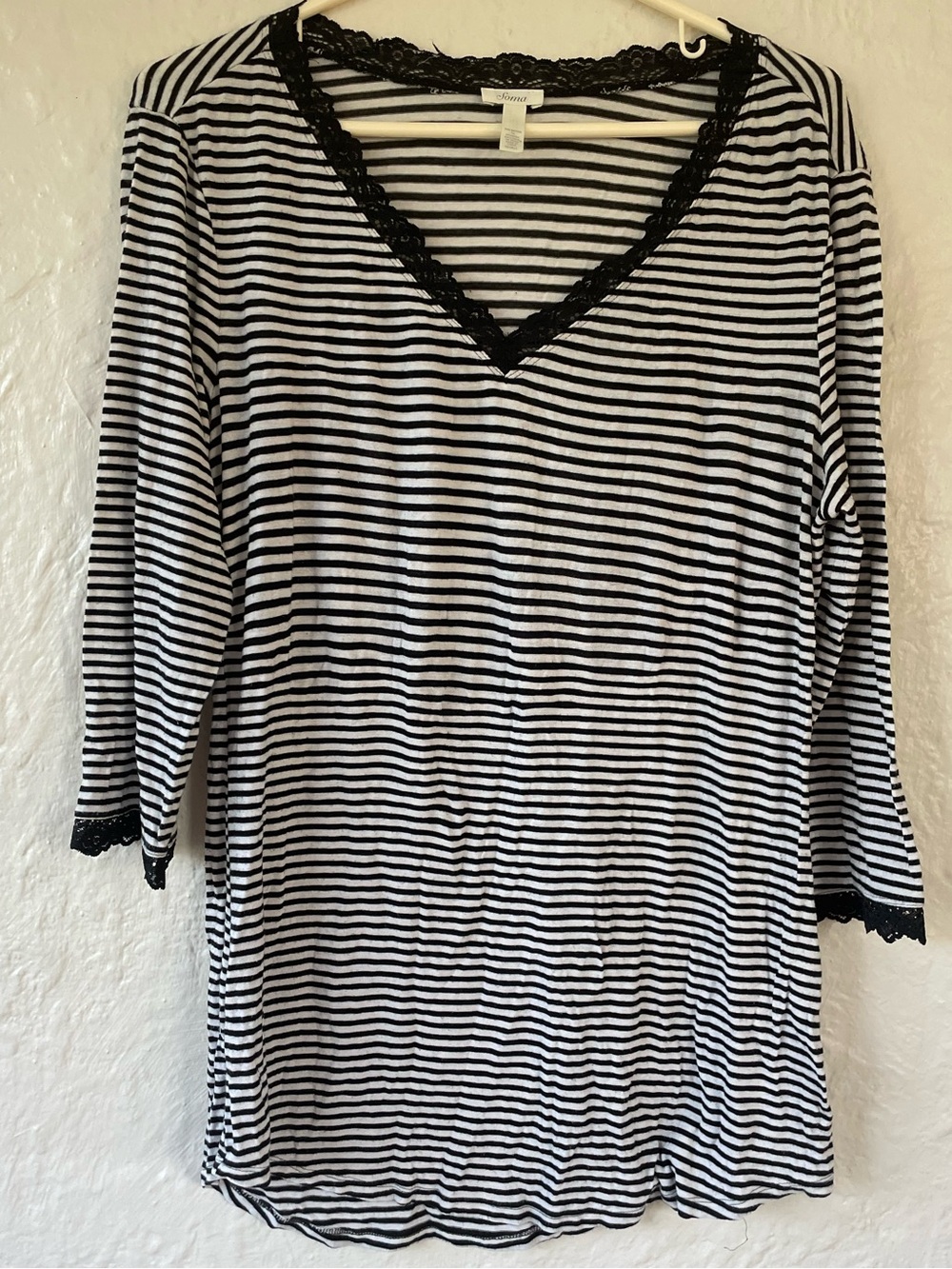 Soma woman’s black and white striped long sleeved, laced lined sleep top; S